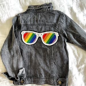 Lola and the boys girls dark denim jacket with rainbow jeweled sunglasses.